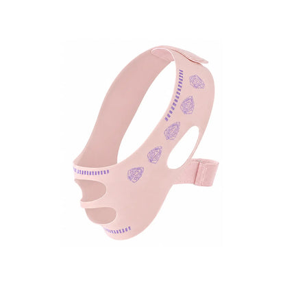 Máscara modeladora facial V-Line rosa exibida sobre fundo branco com aberturas anatômicas para orelhas e queixo Loja Morela
